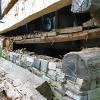 Sill log removed and flooring exposed.