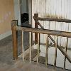 Landing of the stairway to the second floor. The wall behind the rail is a later enclosed bathroom which Bill Hartely and Bob Hansen will remove.