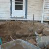 Old foundation rocks were found within the walls of a later porch.