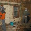 Removing layers of walls and ceiling from the old addition, Bob Hansen's future bedroom.