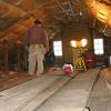 Insulating the attic floor. The floor boards you see here are from the mid eighteenth century period when the house was a story and a half.