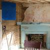 Behind the blue panel is old wallpaper. Under the paint on this mantel is faux marbleing.