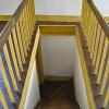 The stairwell and steps which are finished showing their natural wear.