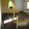 Second floor landind, the steps in front of the window lead up to the attic.