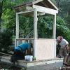 The well house takes shape, a copy from the 18th century. 